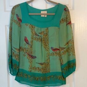 Green silk top.